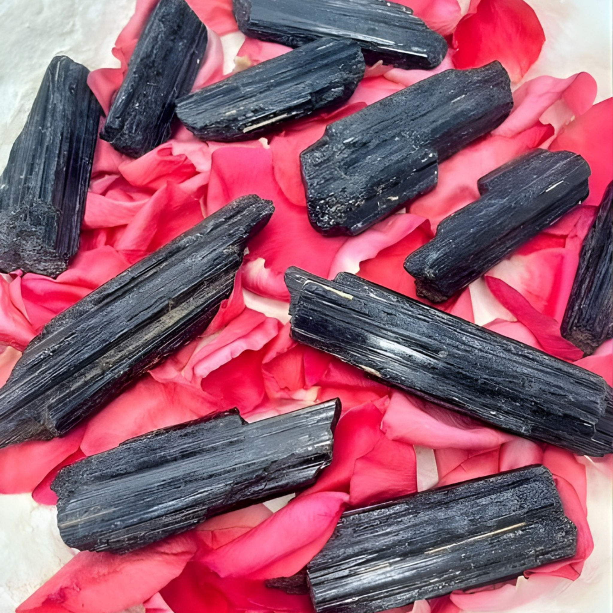 Black crystals on pink petals
