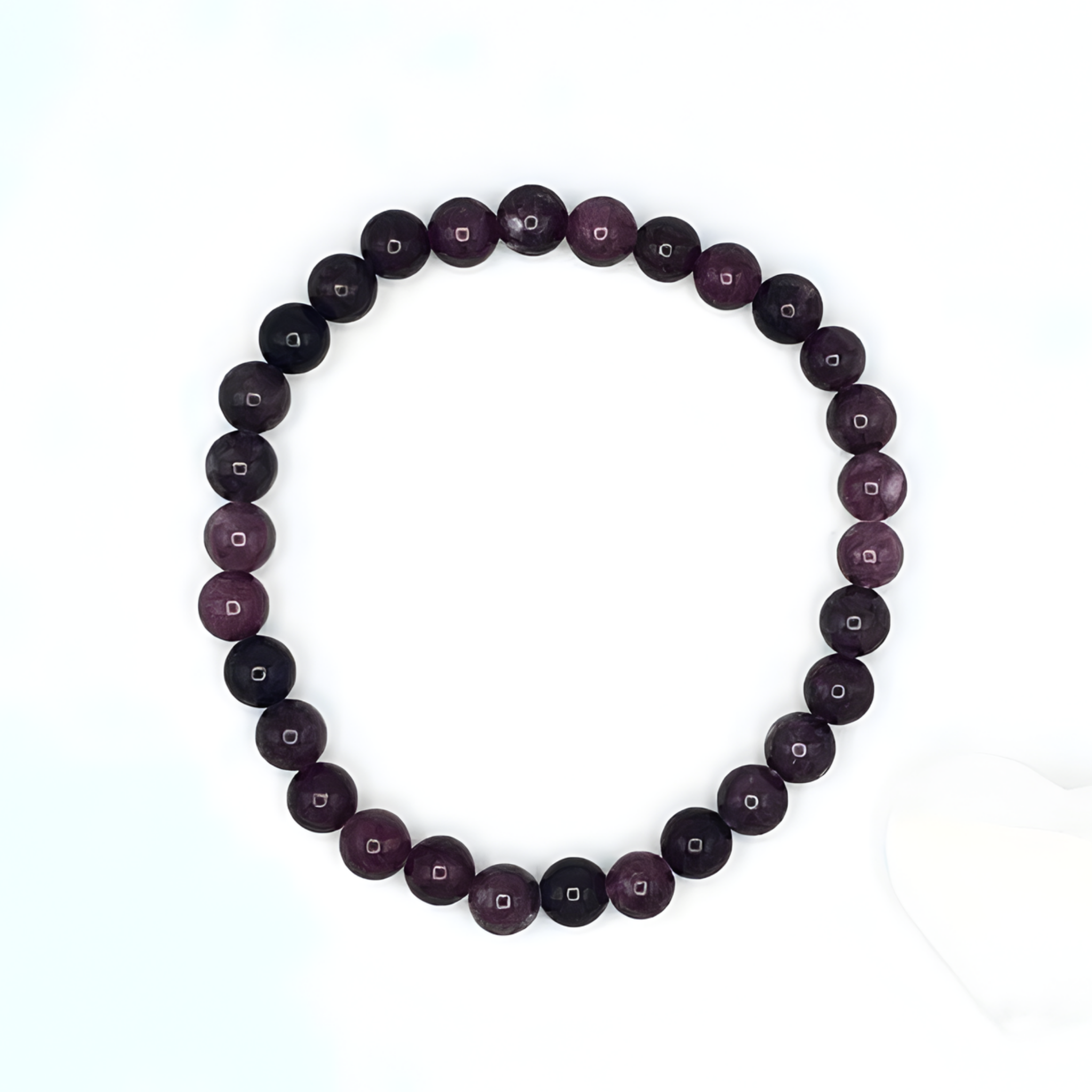 Purple beaded bracelet on a white background