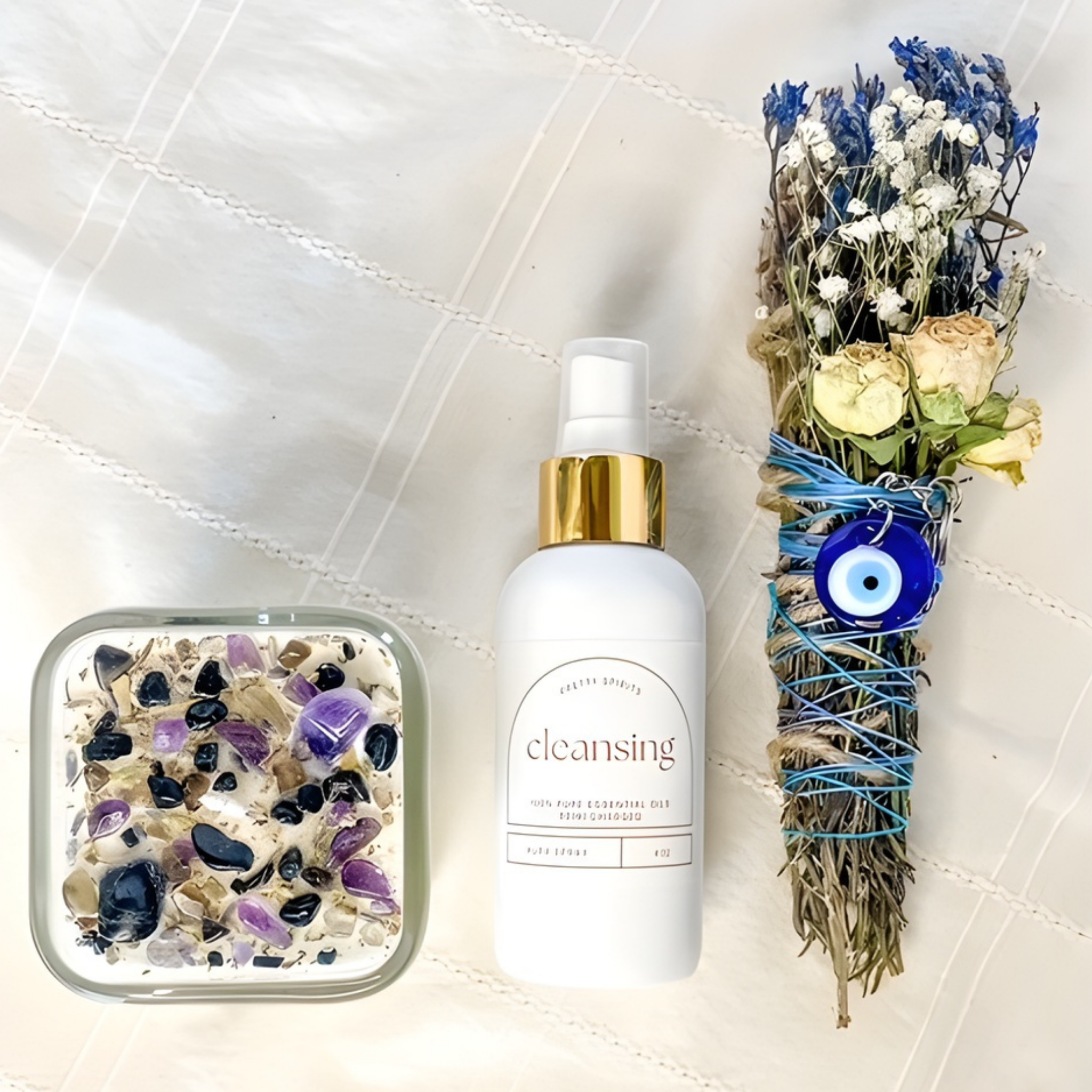 Cleansing product with decorative stones, flowers, and an evil eye amulet on a textured surface.