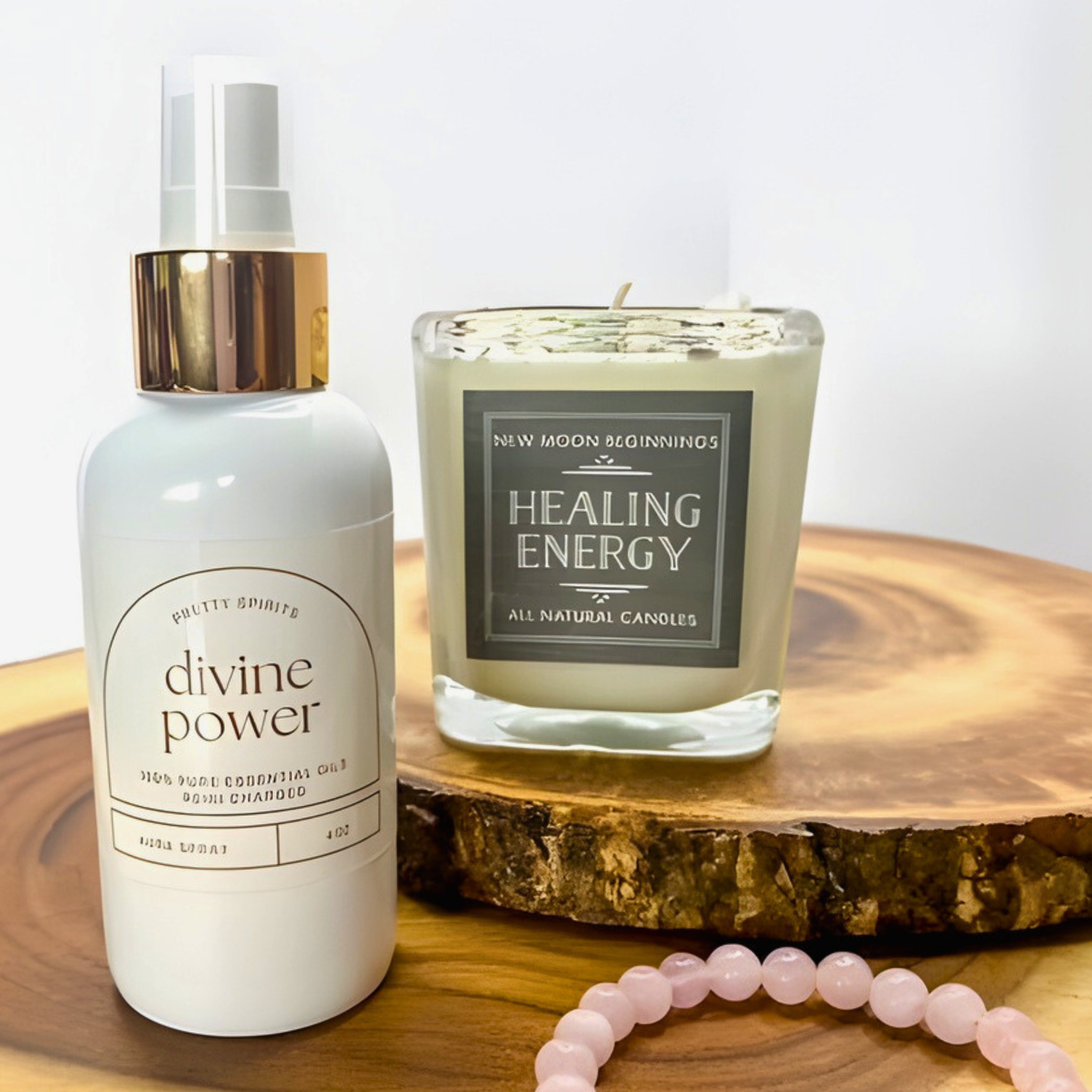 White bottle labeled 'divine power' and a candle labeled 'Healing Energy' on a wooden surface.