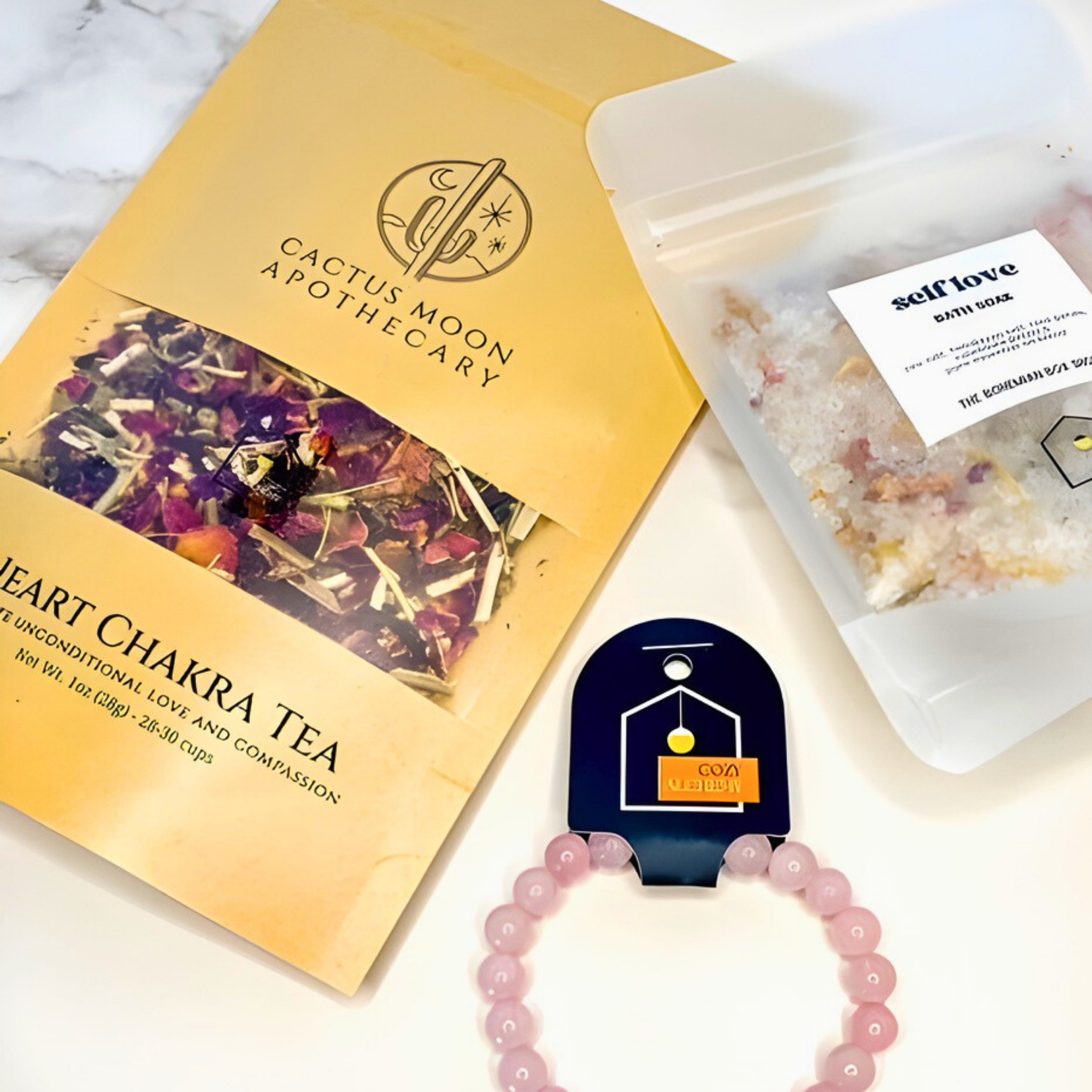 Cactus Moon Apothecary tea package with a bracelet and small container on a marble surface