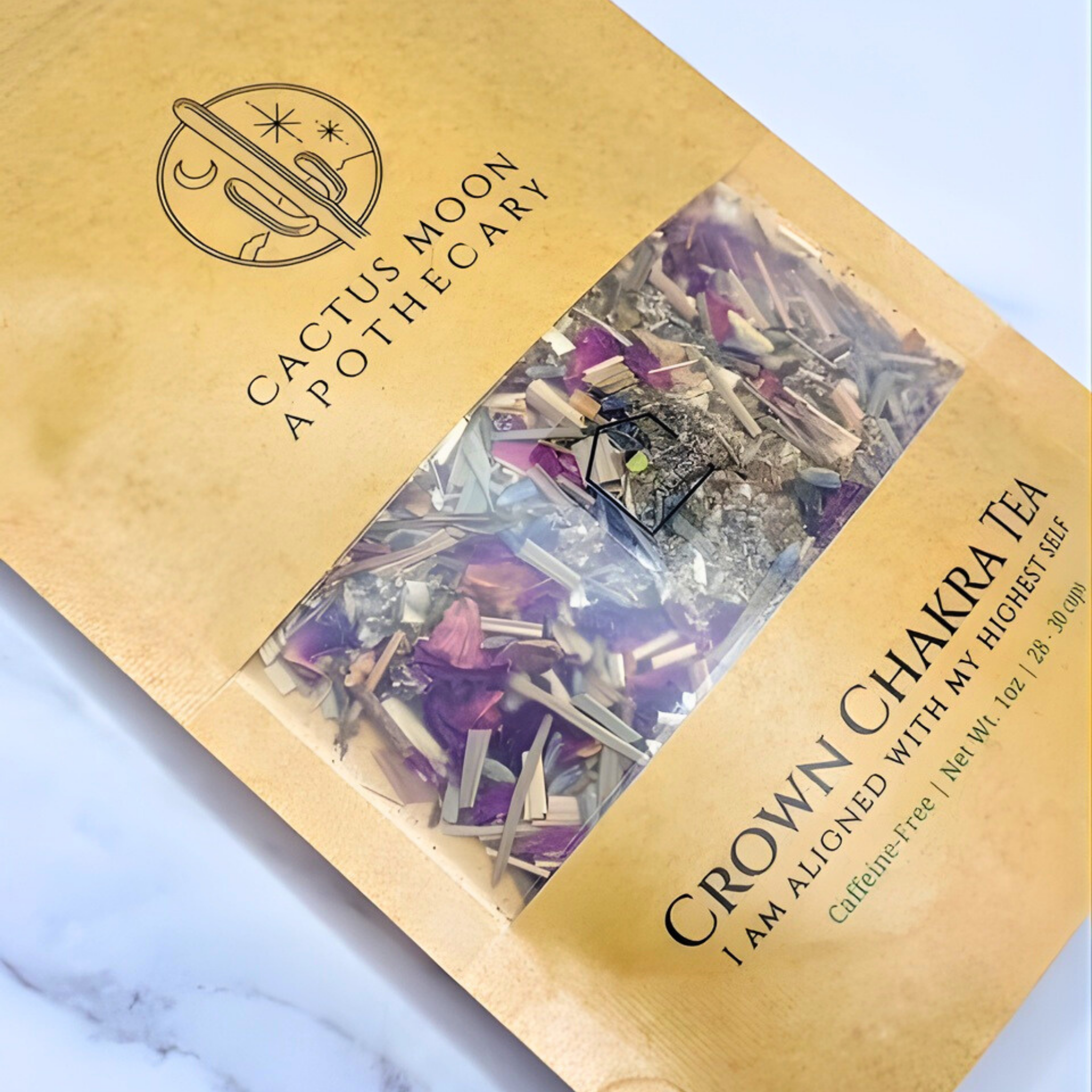 Cactus Moon Apothecary Crown Chakra Tea packaging on a marble surface
