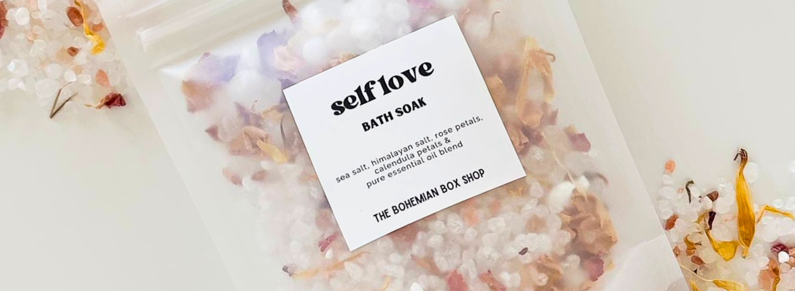 Bath soap with a 'self love' label on a decorative background