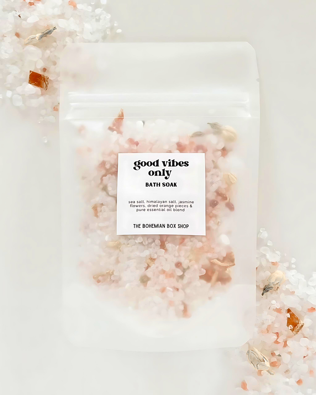 Bath soap with 'good vibes only' label and decorative elements on a light background