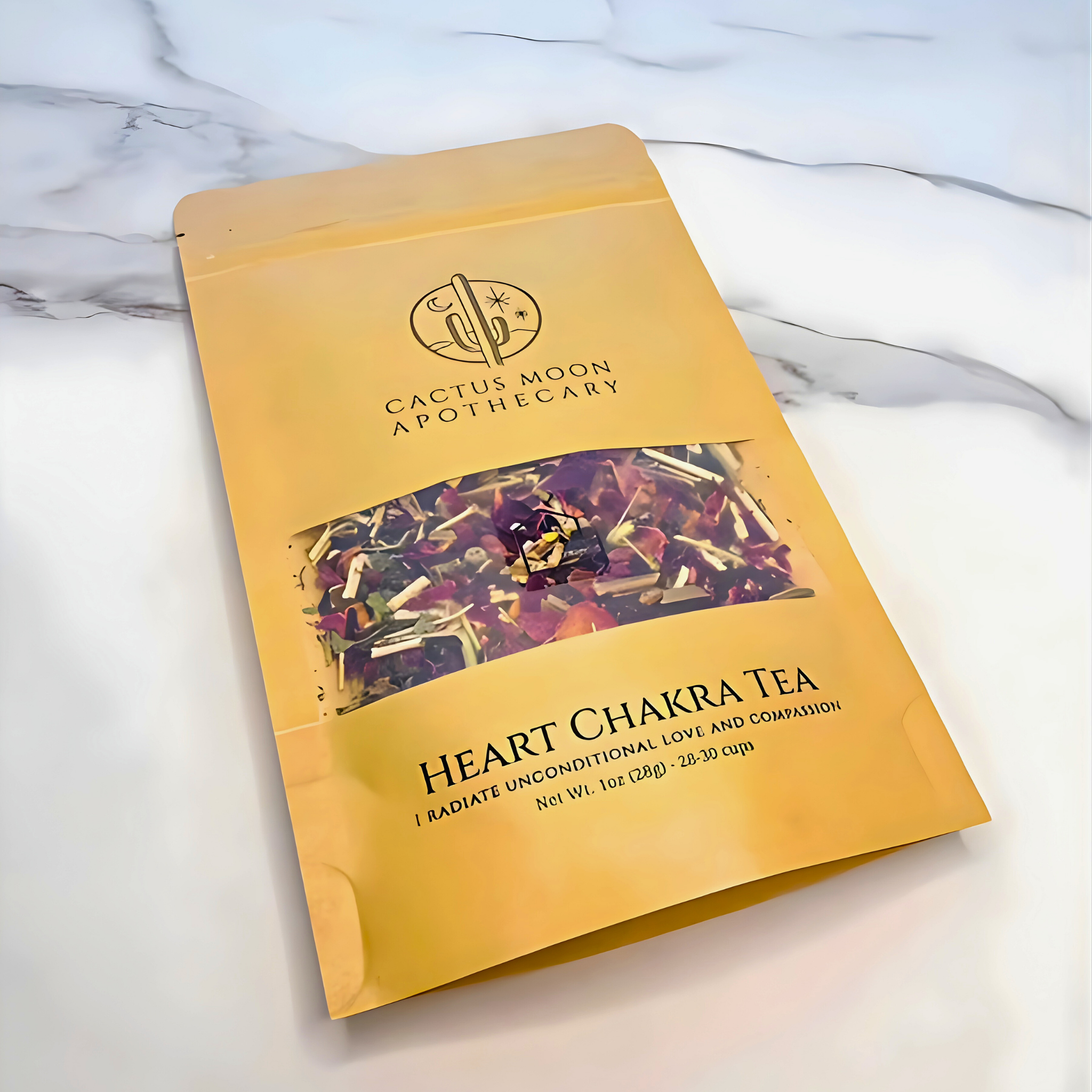 Yellow package of Heart Chakra Tea from Cactus Moon Apothecary on a marble surface