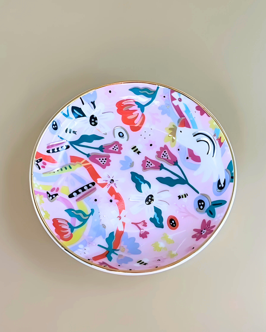 Round plate with colorful floral pattern on a beige background