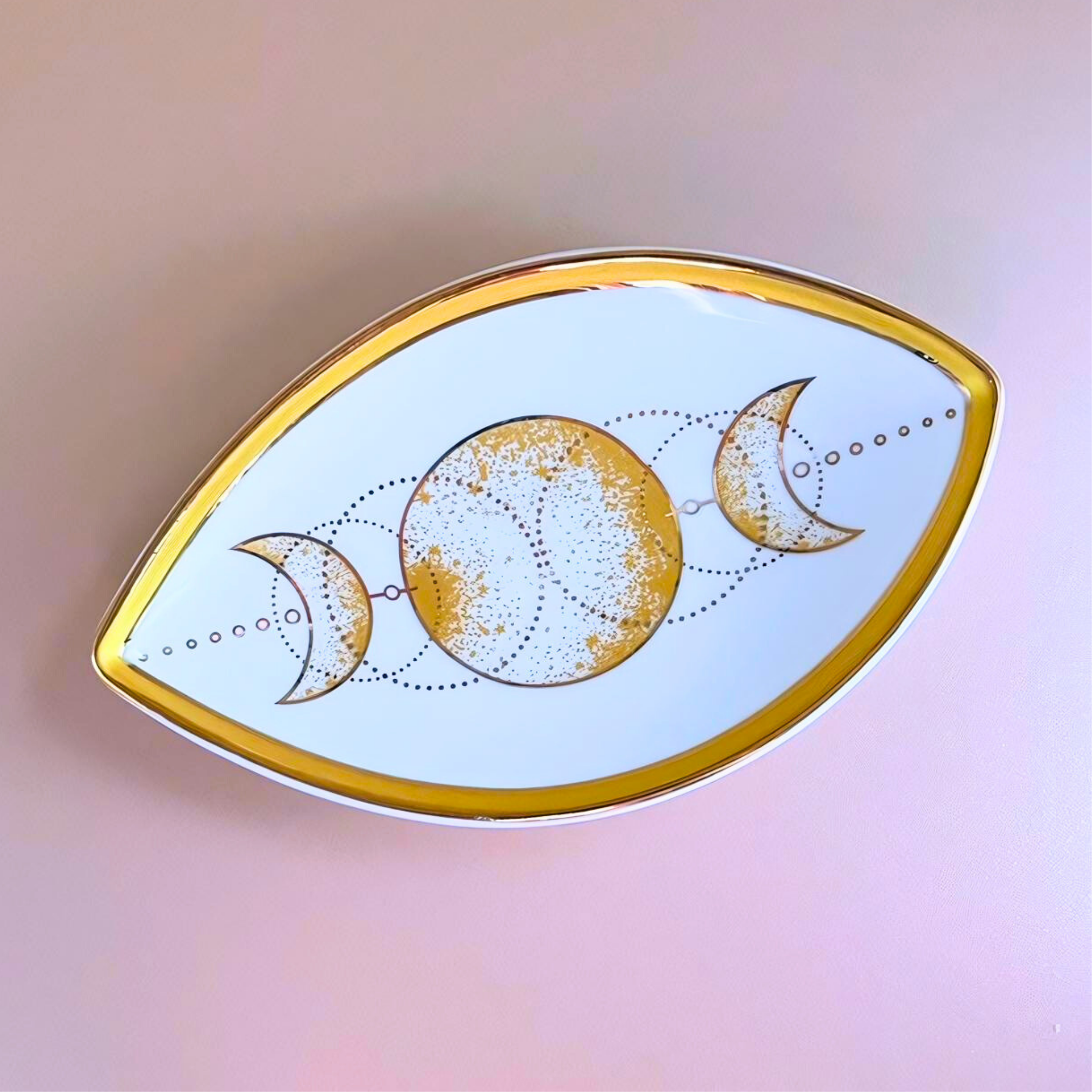 Pin with moon phases design on a blurred background