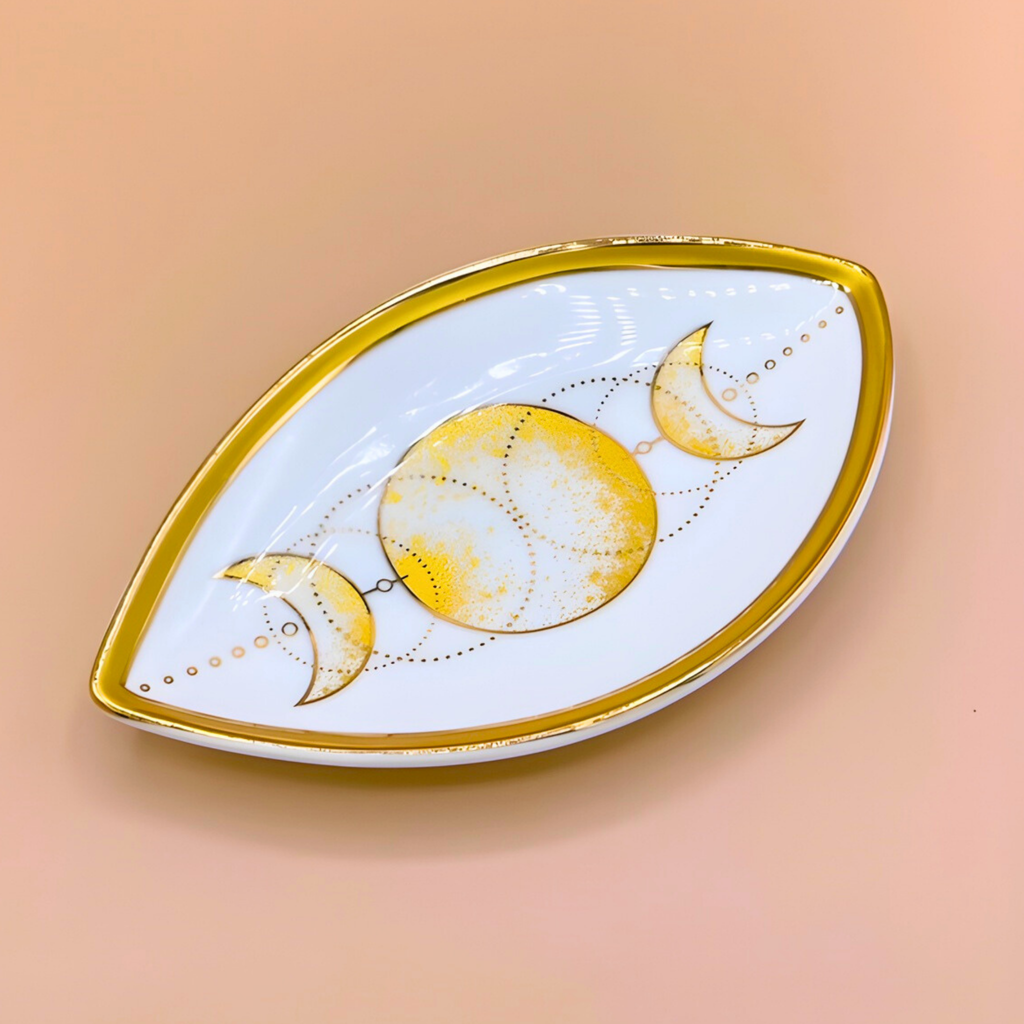 Decorative plate with moon phases on a peach background