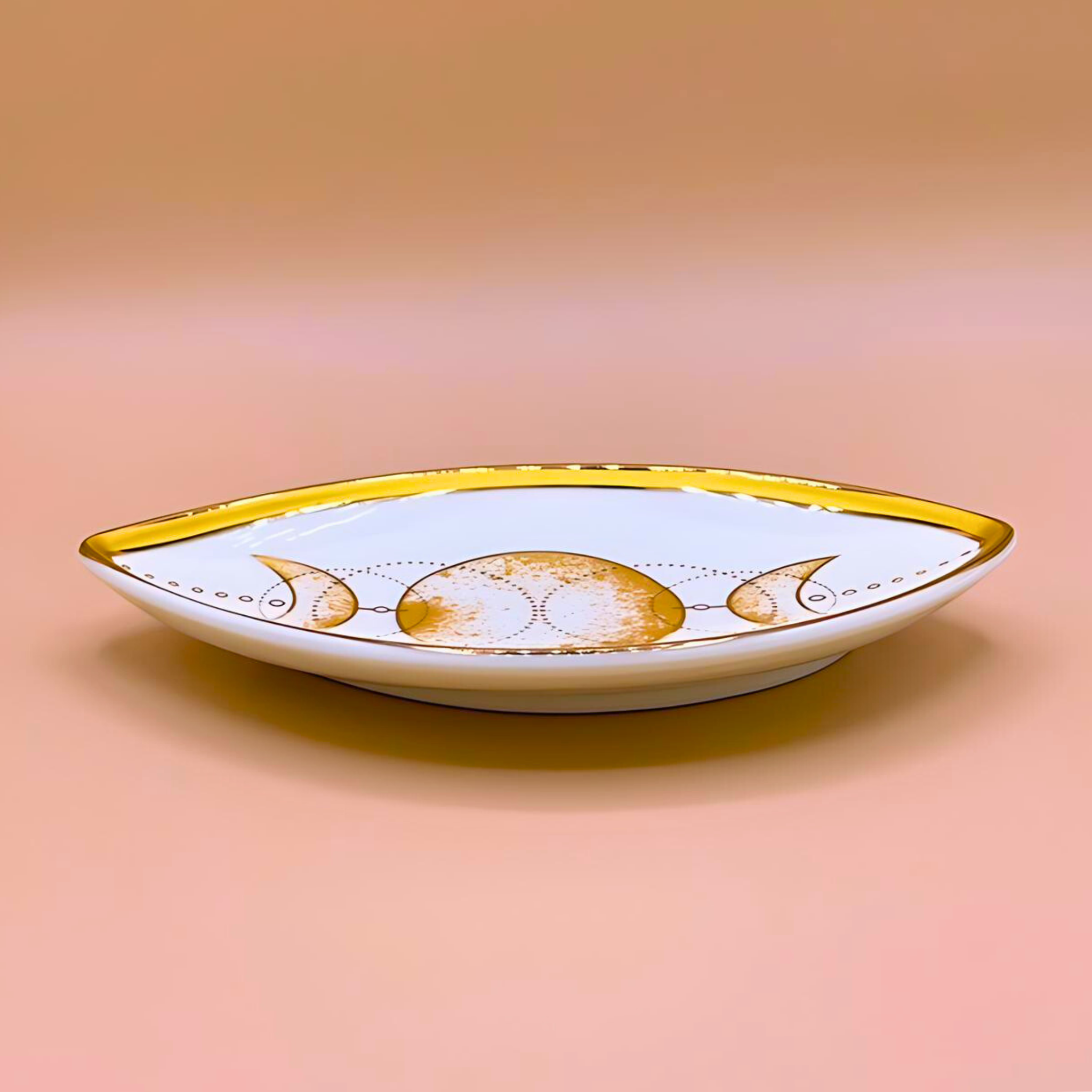 Decorative plate with gold accents on a peach background