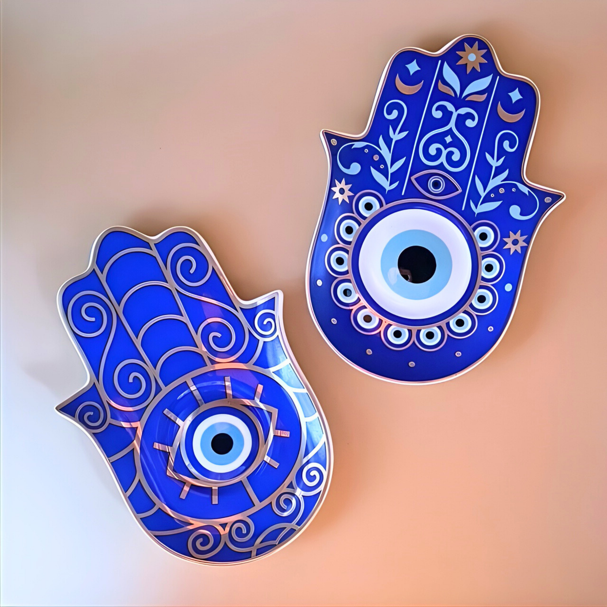 Two blue Hamsa hand decorations with eye design on a gradient background