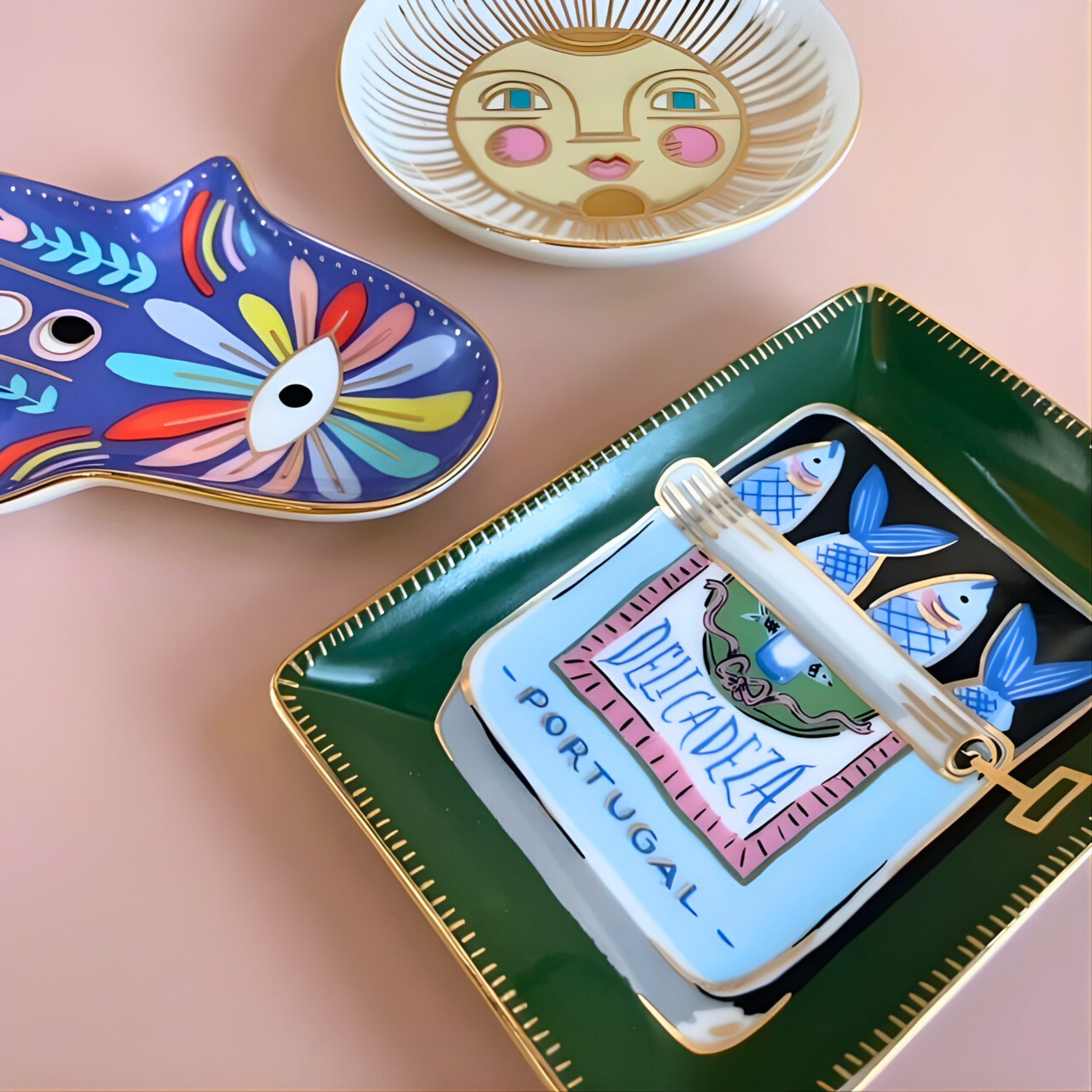 Decorative plates with colorful designs on a pink surface