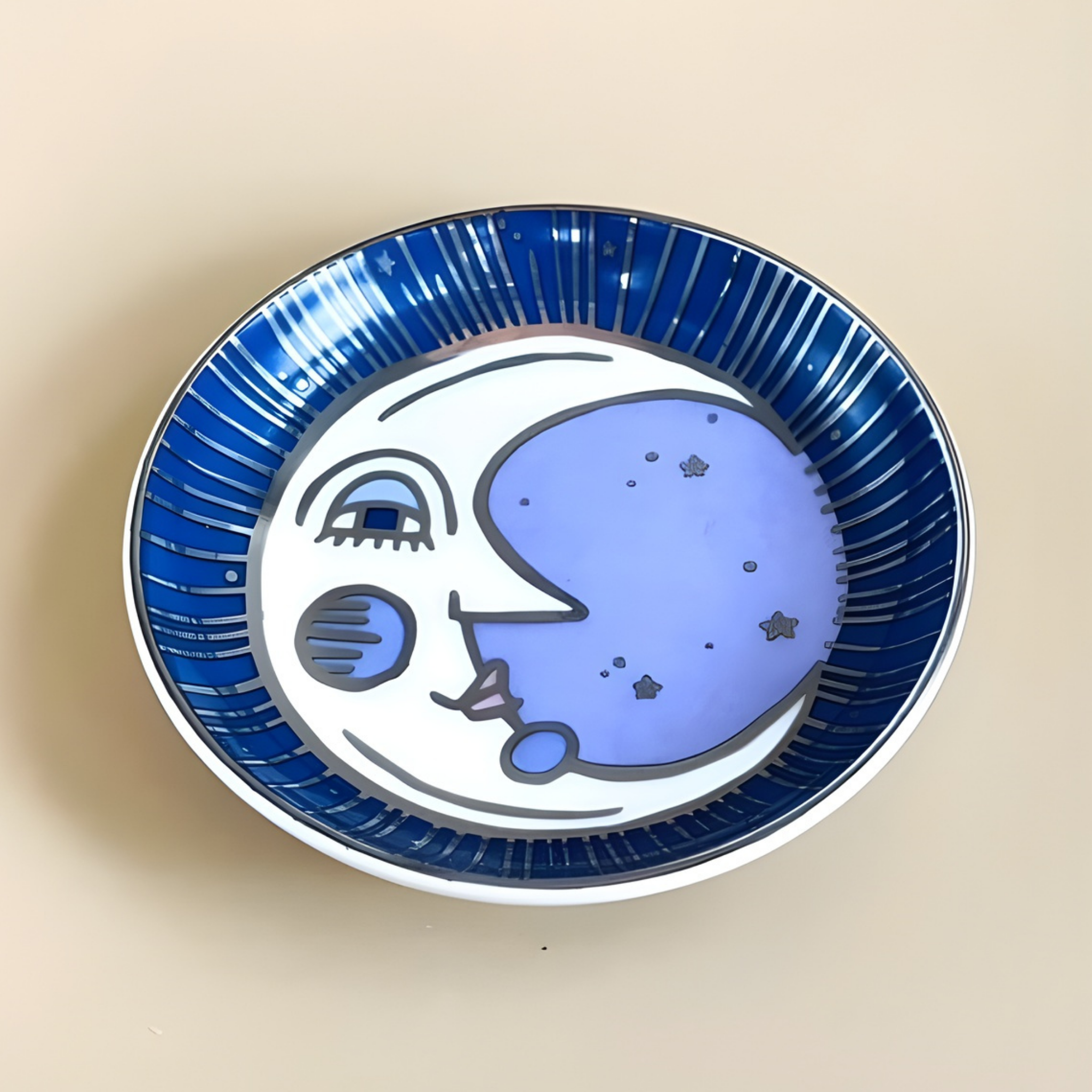 Ceramic plate with a blue and white design of a face on a beige background