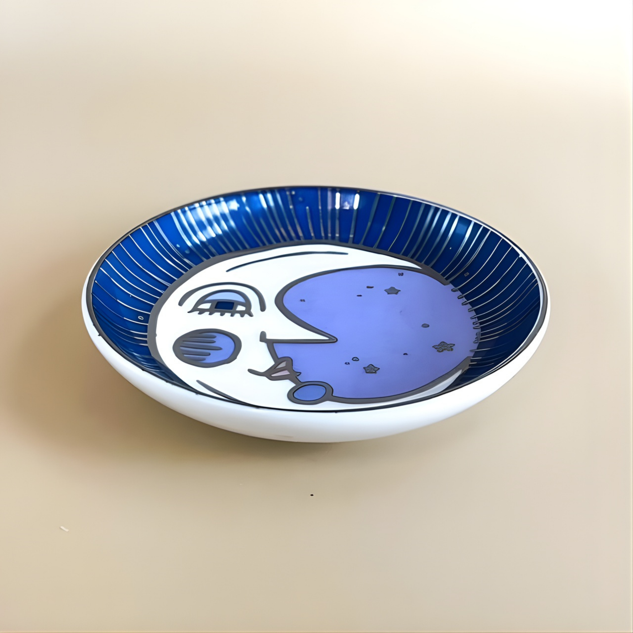 Ceramic plate with moon design on a beige background