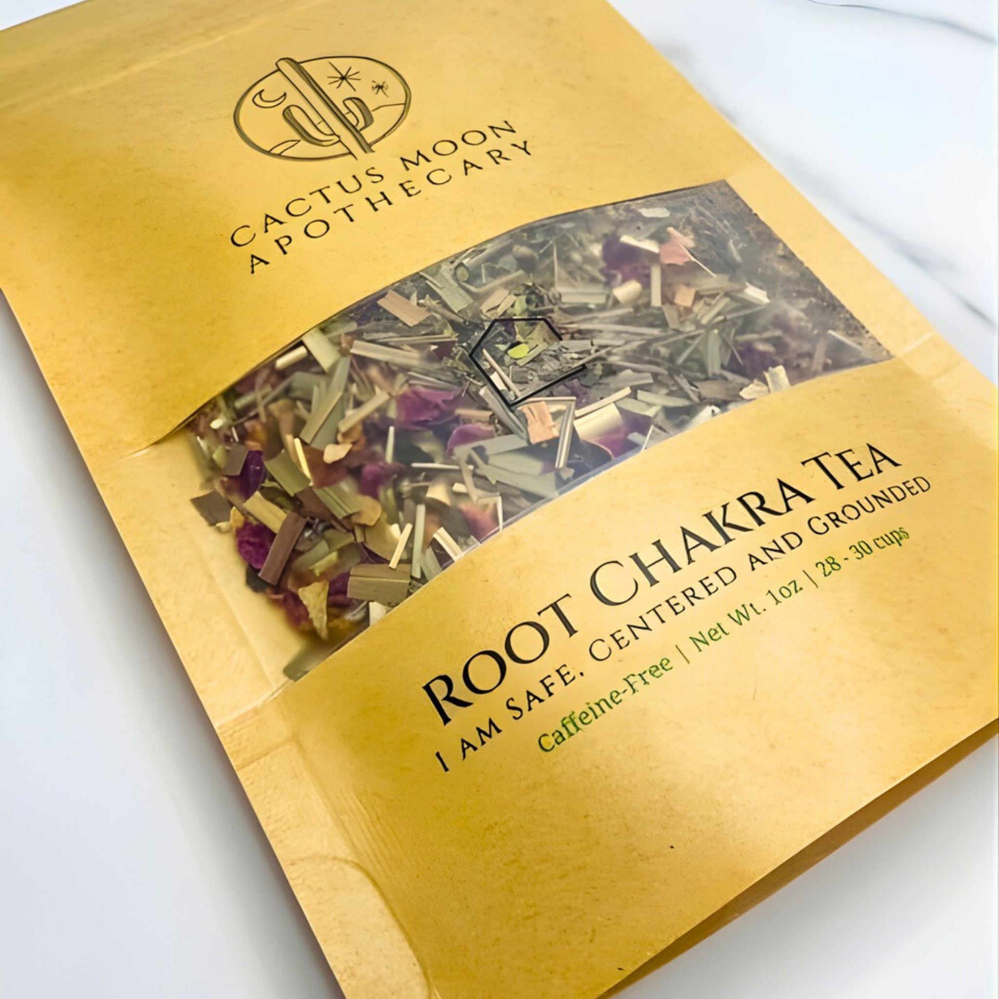 Gold package of Root Chakra Tea from Cactus Moon Apothecary on a white background