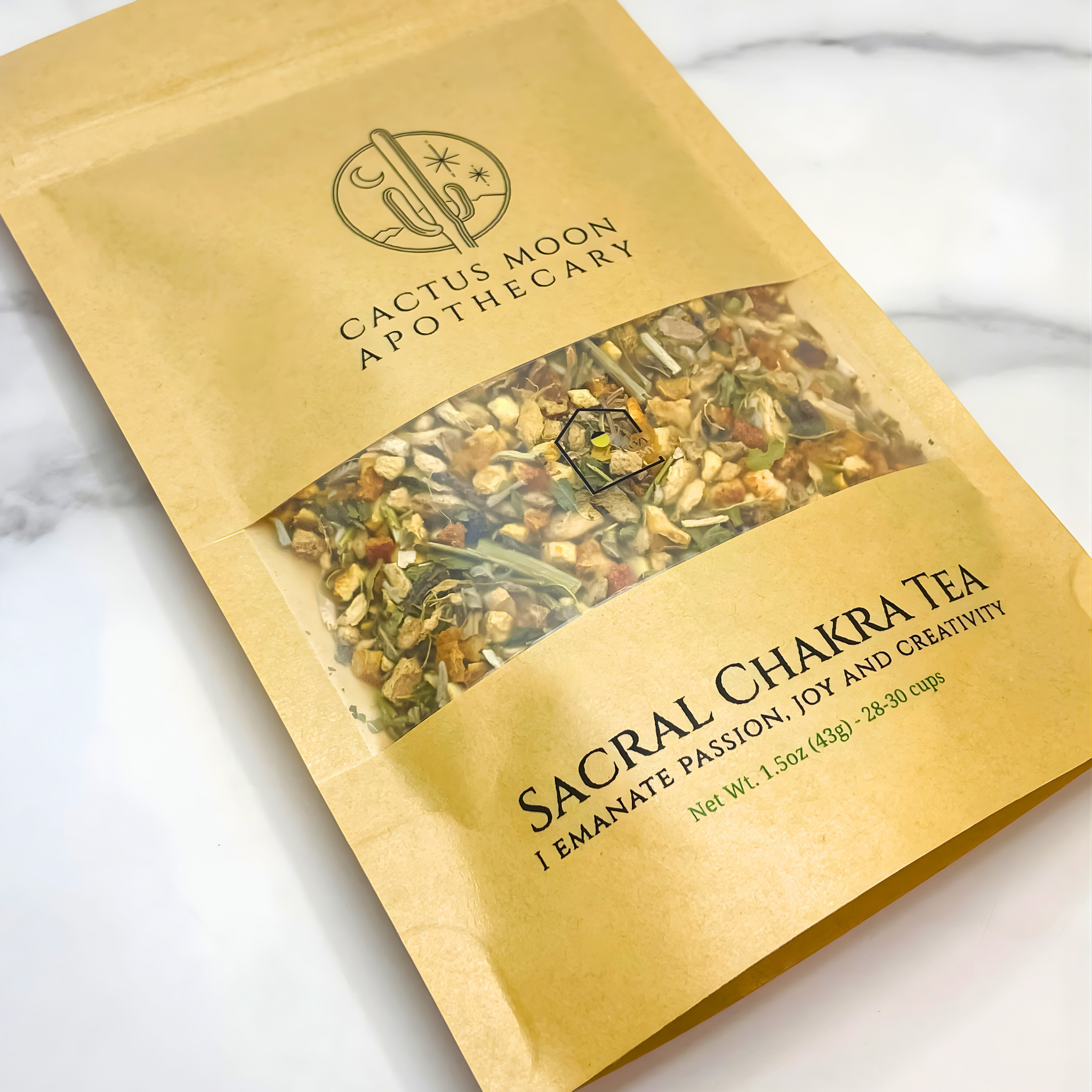 Sacral Chakra Tea package from Cactus Moon Apothecary on a marble surface