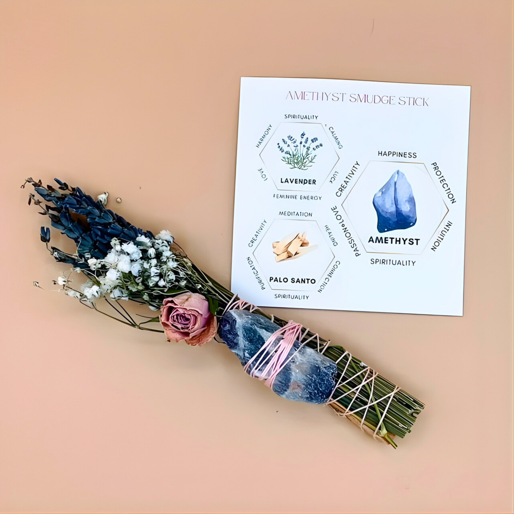 Amethyst smudge stick with a card on a peach background