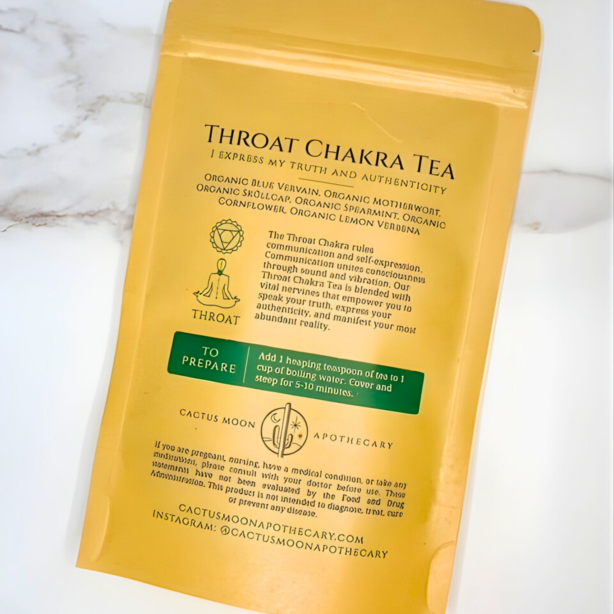 Yellow package of Throat Chakra Tea with text on a marble background